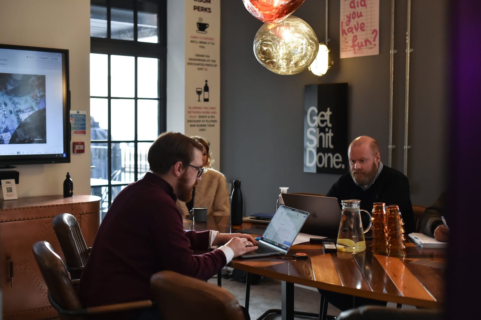 A meeting around the table in the Boardroom at 1 Mill Street, Leamington Spa