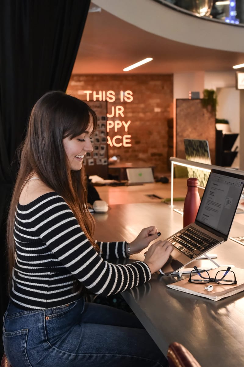 A member at their desk on the coworking floor at 1 Mill Street