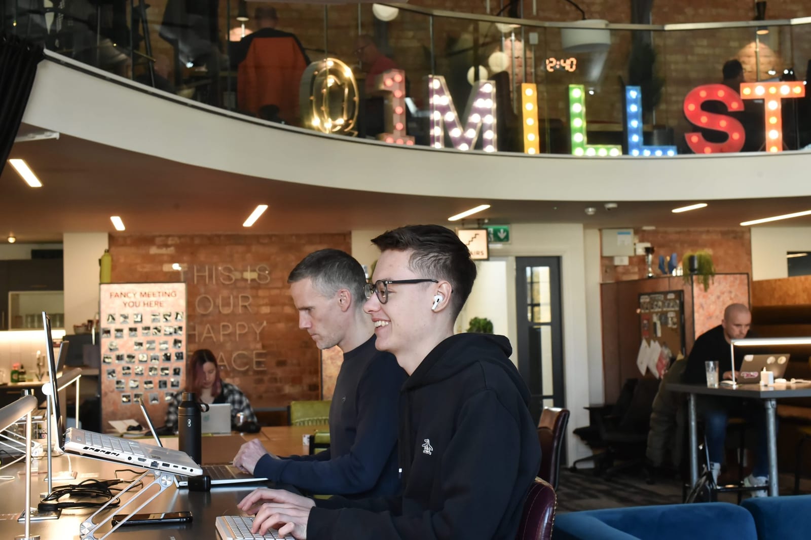Coworking desks under the Mill St letters