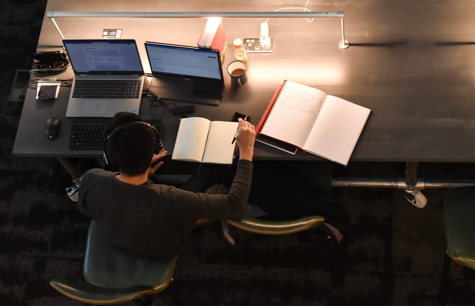 Overhead view of a team working at a shared desk