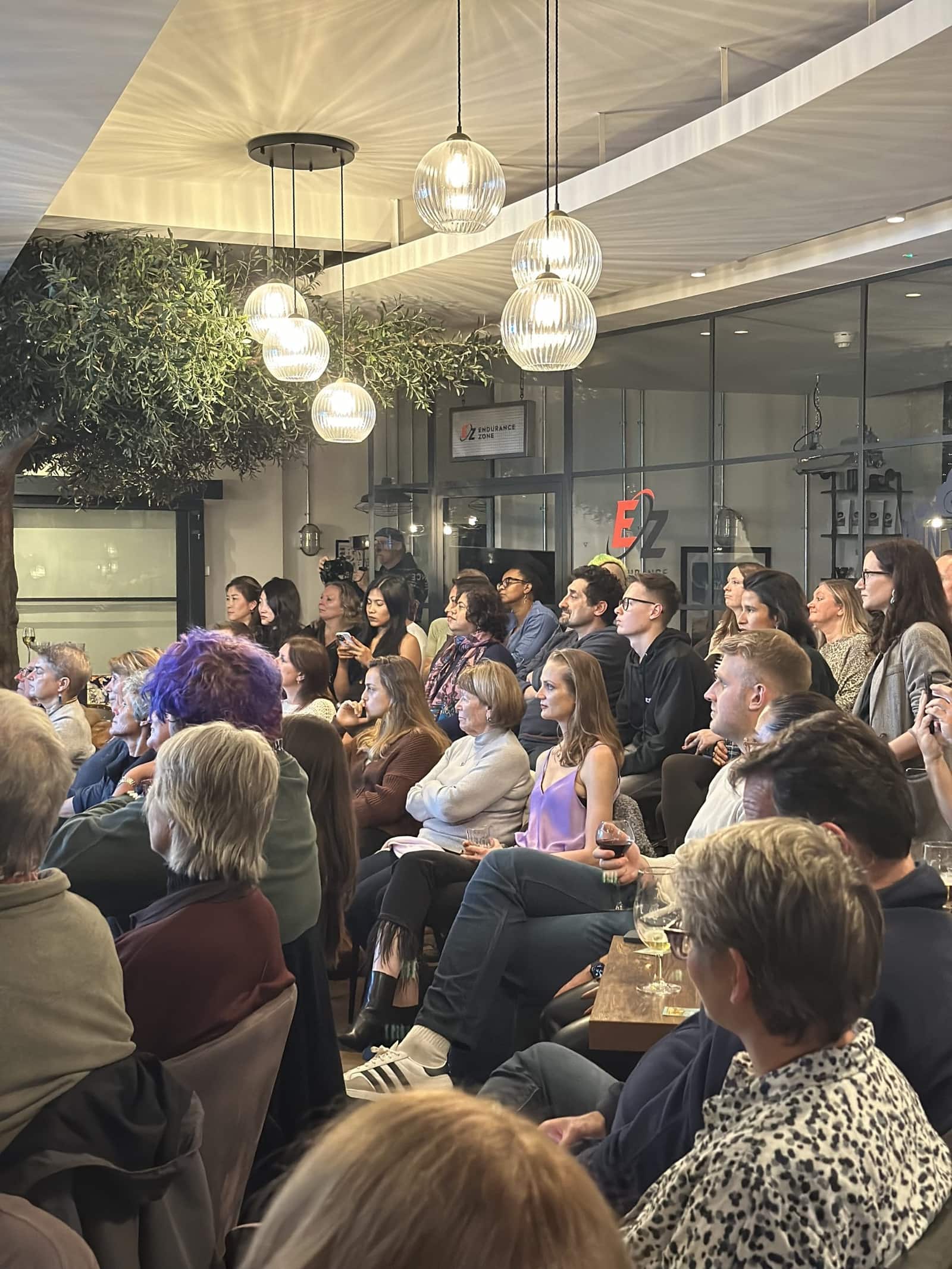 Members listening to a talk at 1 Mill Street