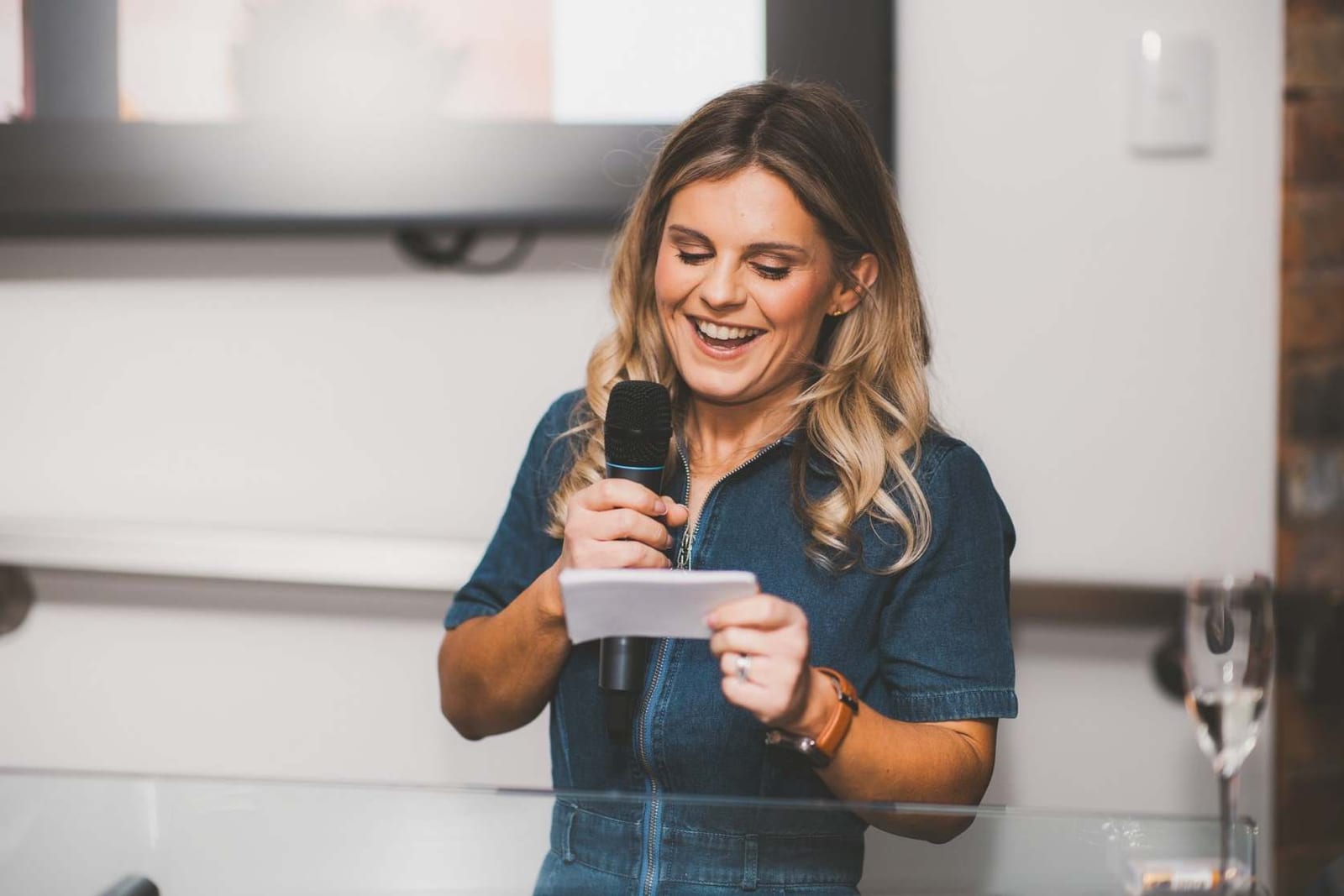 Mari Carmen of Matresa smiling as she speaks into a microphone at an event