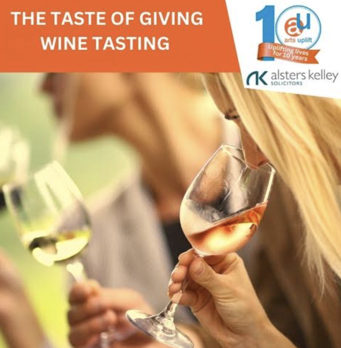 two wine glasses with wine clinking