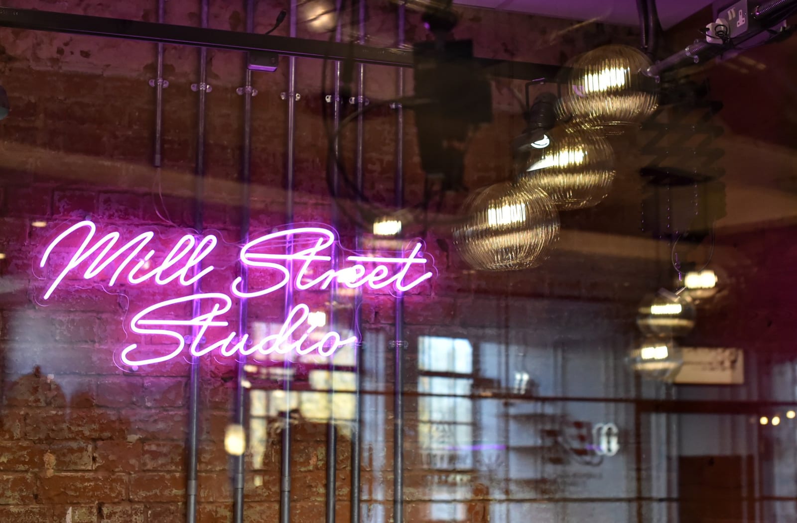 The neon-lit content and podcast studio at 1 Mill Street, Leamington Spa
