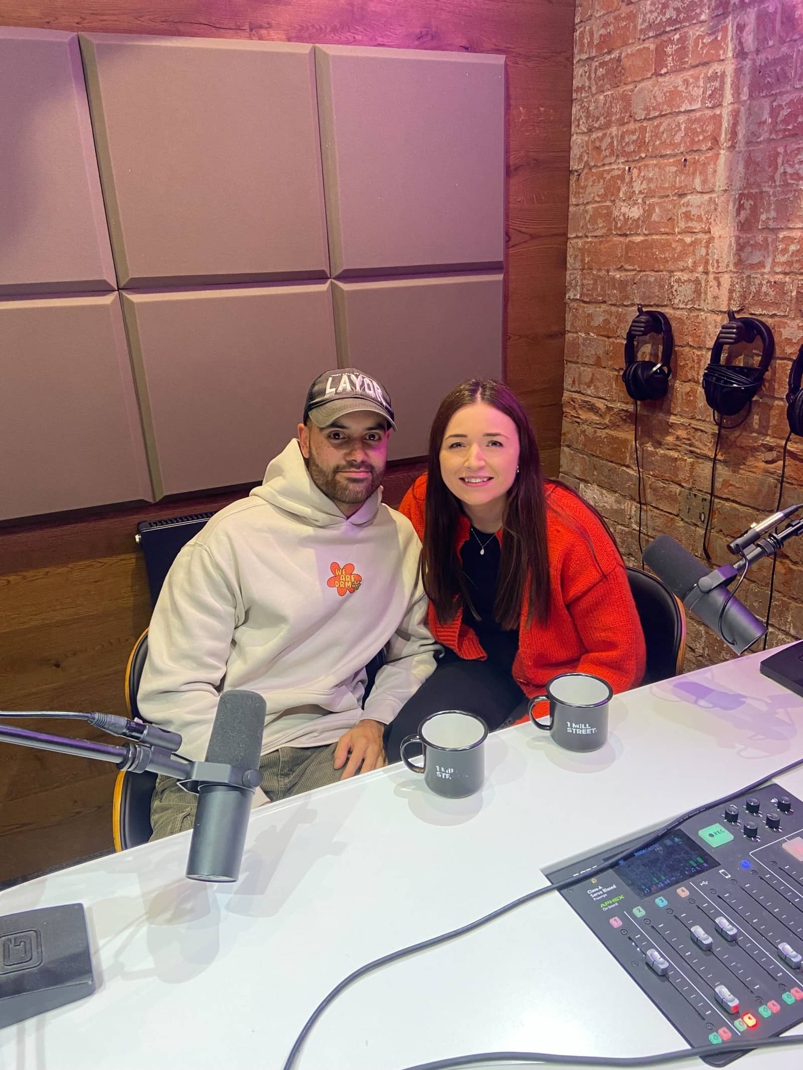 Podcast guests recording a conversation in the studio