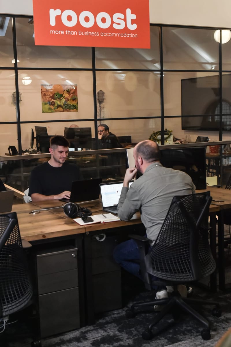 A small team at their desks in a four-person office